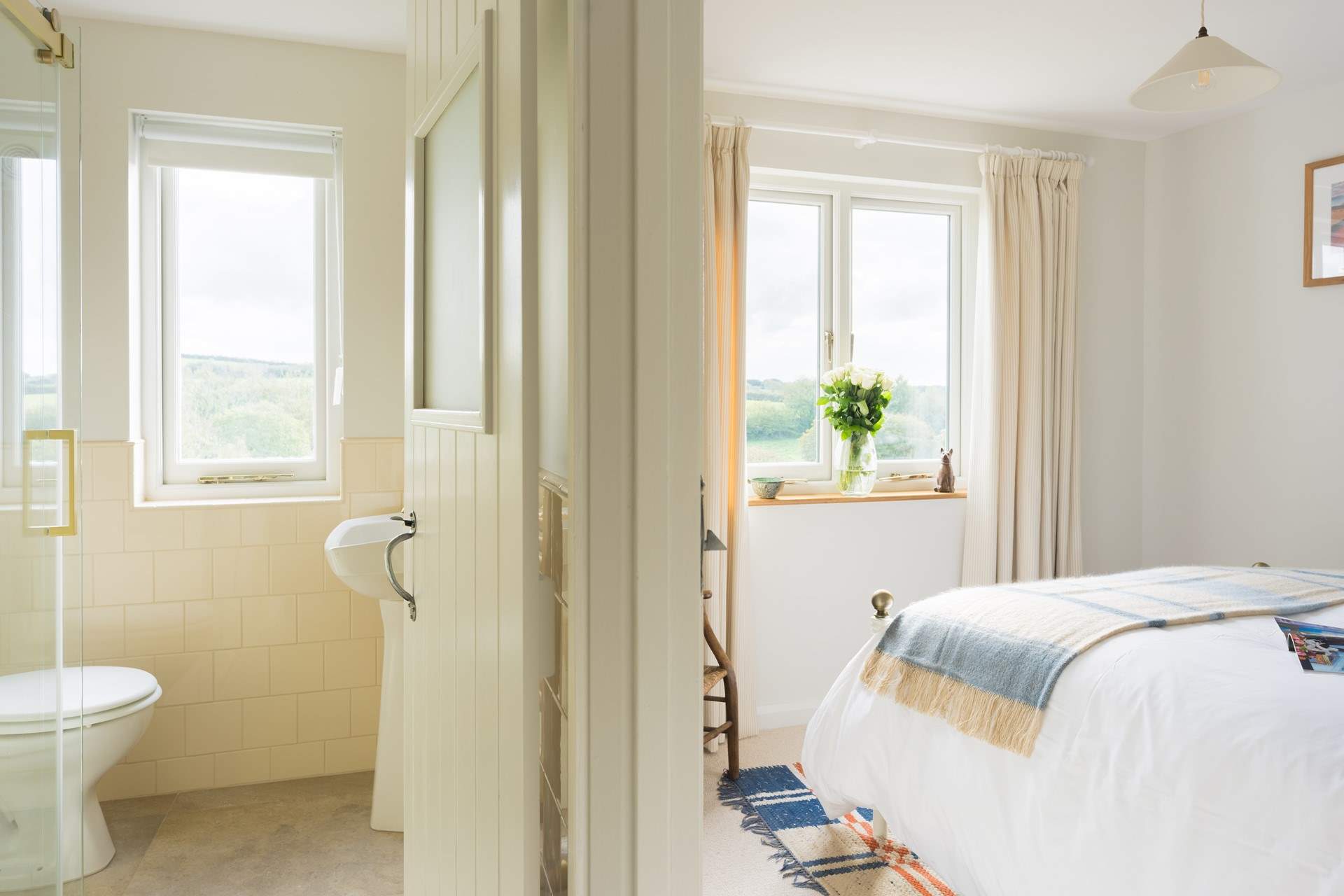 The calmest of shower-rooms with a gorgeous glow from the milky cream tiles.
