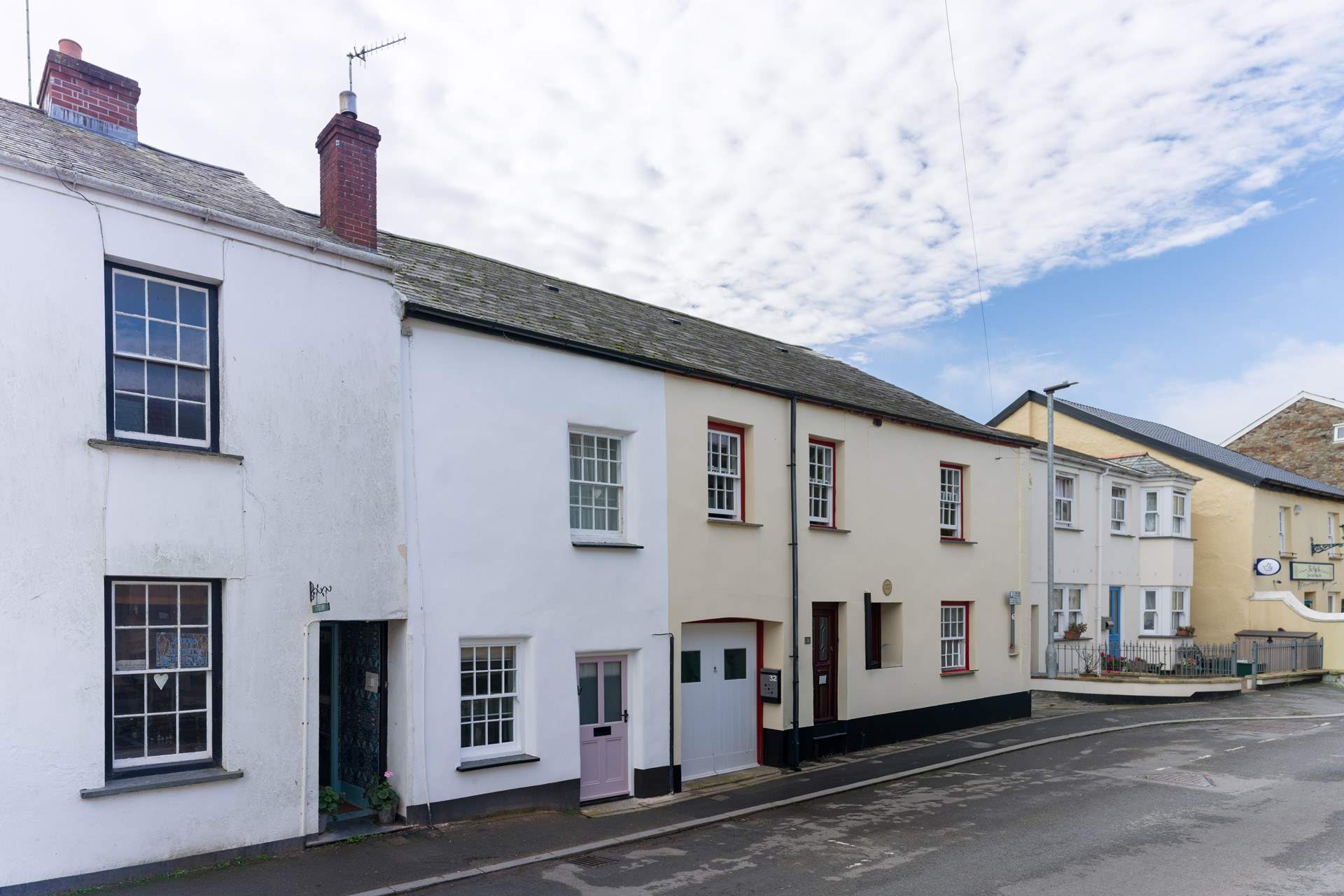 Cobblers Cottage, in the heart of the village, with the pretty pink original door. Please remember to duck!