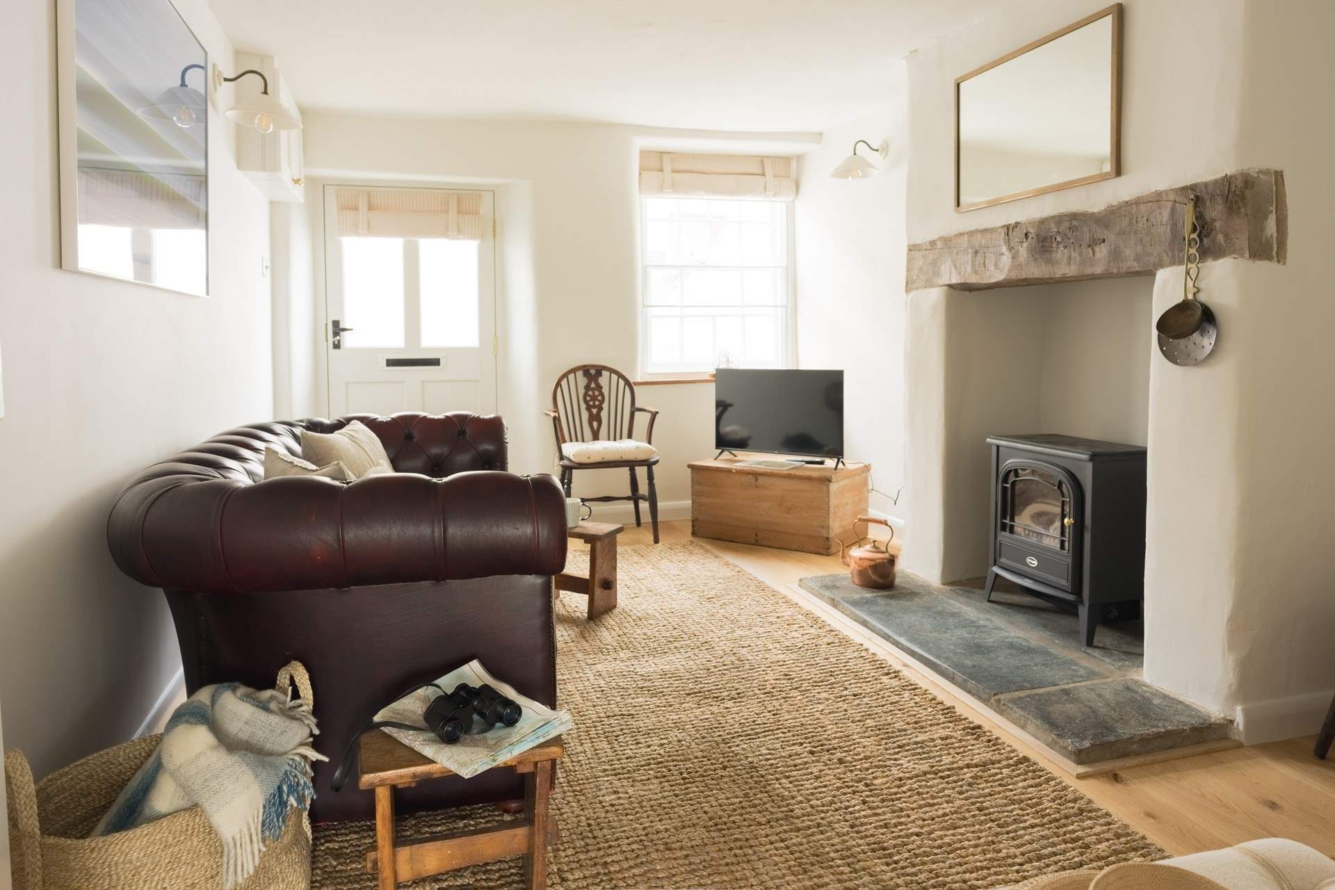 The cosy sitting-room awaits your arrival with a wood-burner effect electric stove to take the chill away on those autumnal nights. 
