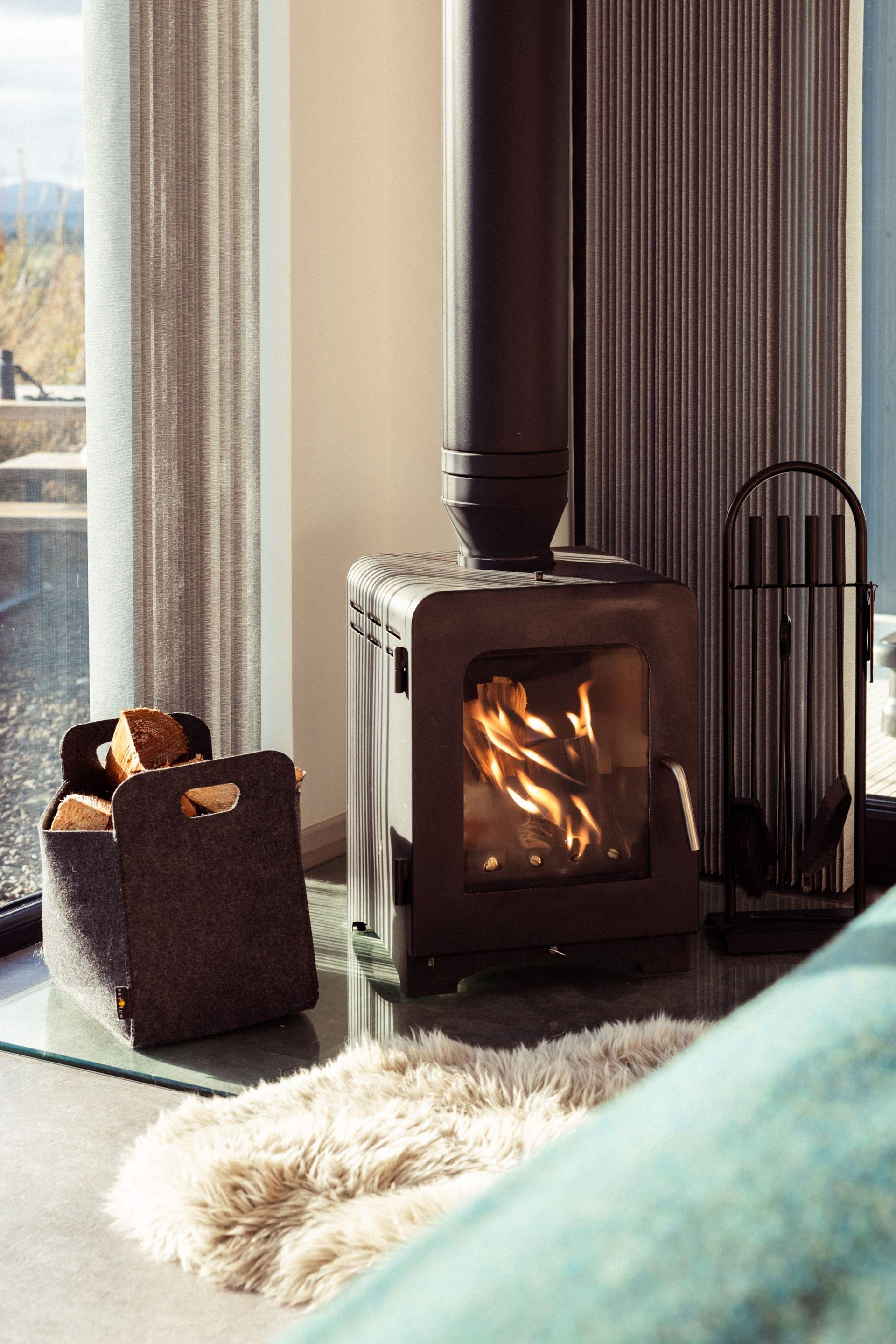 Stay toasty beside flickering flames.