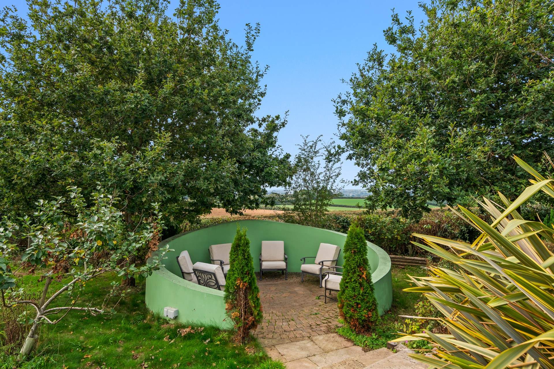 Another cute space within the garden to retire to with a good book.