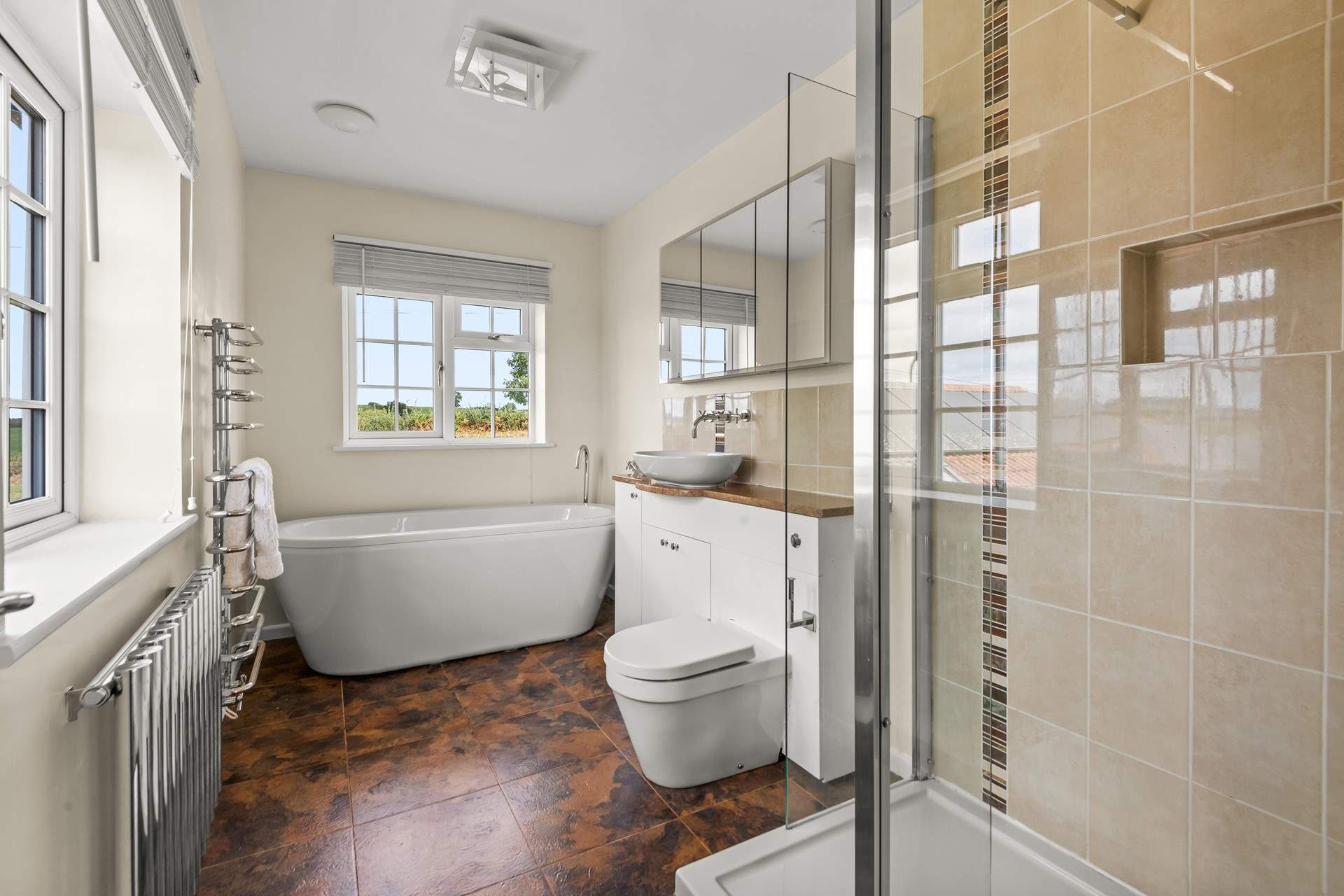 The en suite to bedroom 2 has a glorious tub and shower cubicle.