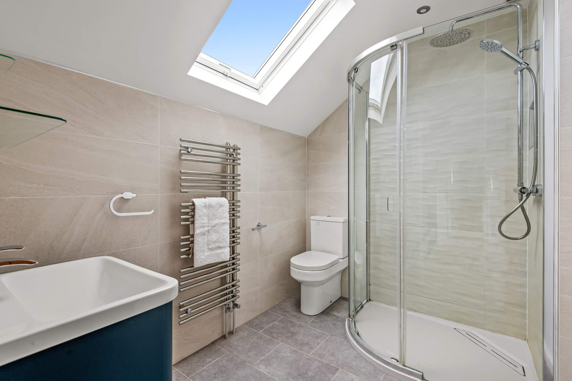 Next door to bedroom 4 is the family shower-room.