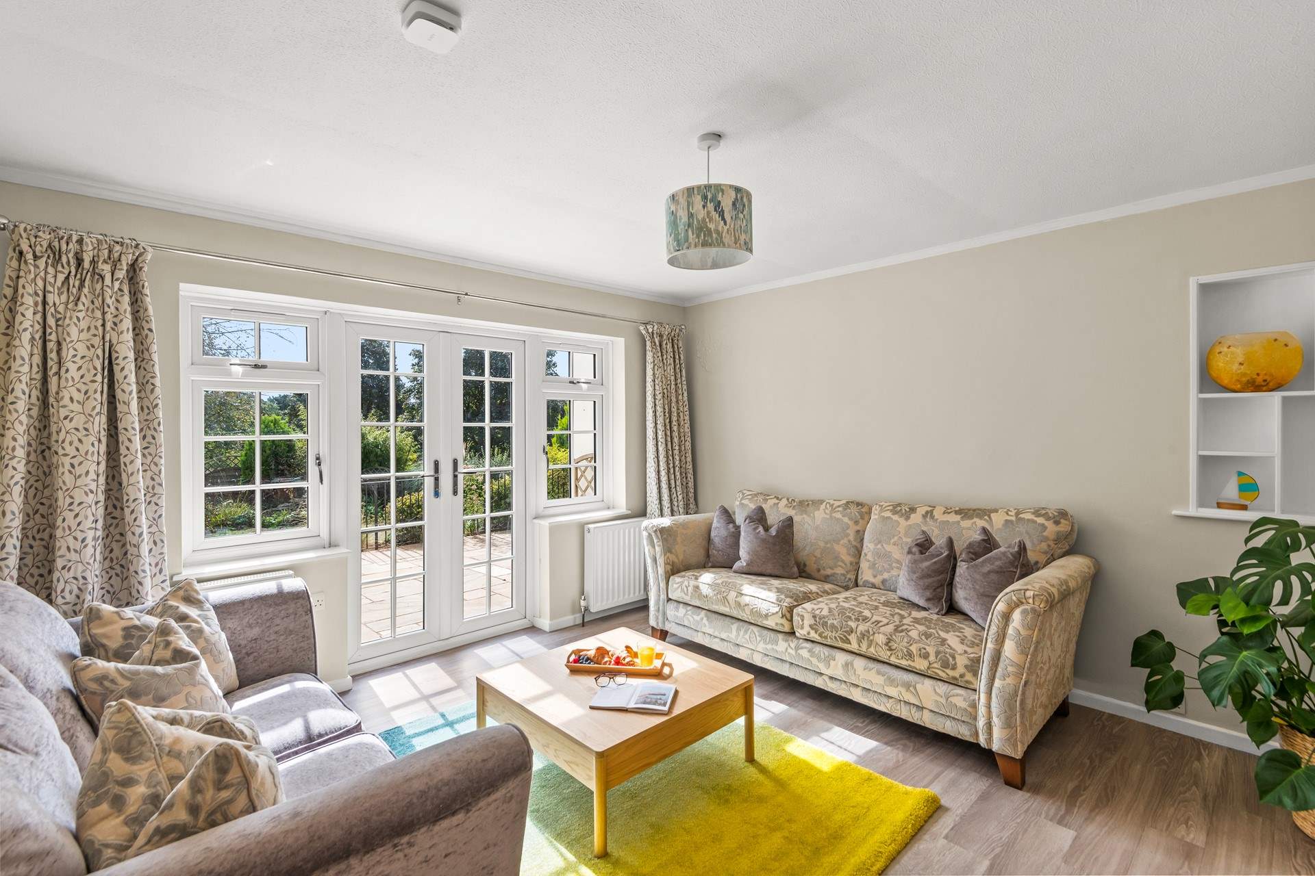 The second sitting-room is another lovely space to really relax and unwind in. This beautiful sun-room also opens out onto the patio.