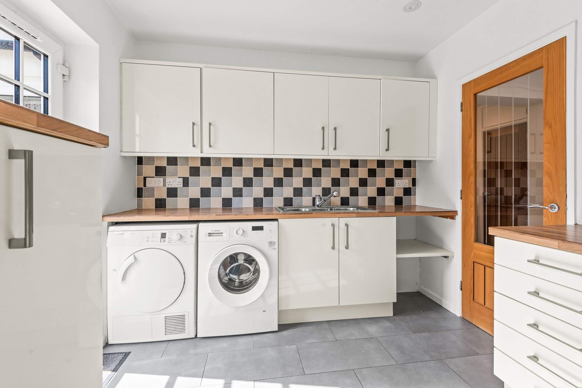 Back in the house, the utility-room is the perfect place for washing and drying the day's swimming costumes, along with being a great storage place or possibly a peaceful sanctuary for your dog(s).