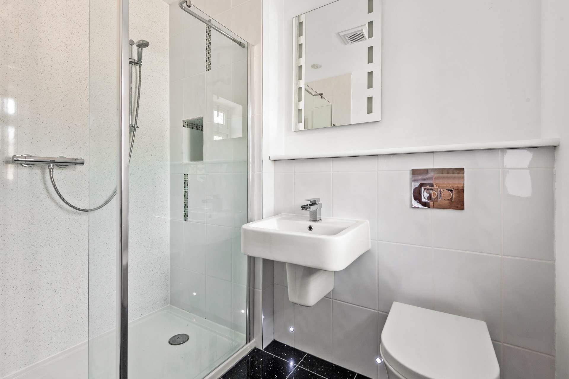 The en suite in the annexe is home to a large shower cubicle.