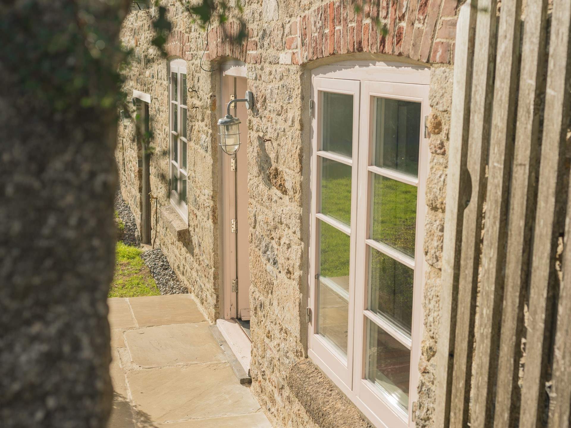 Open the gate and head down to the front door. 