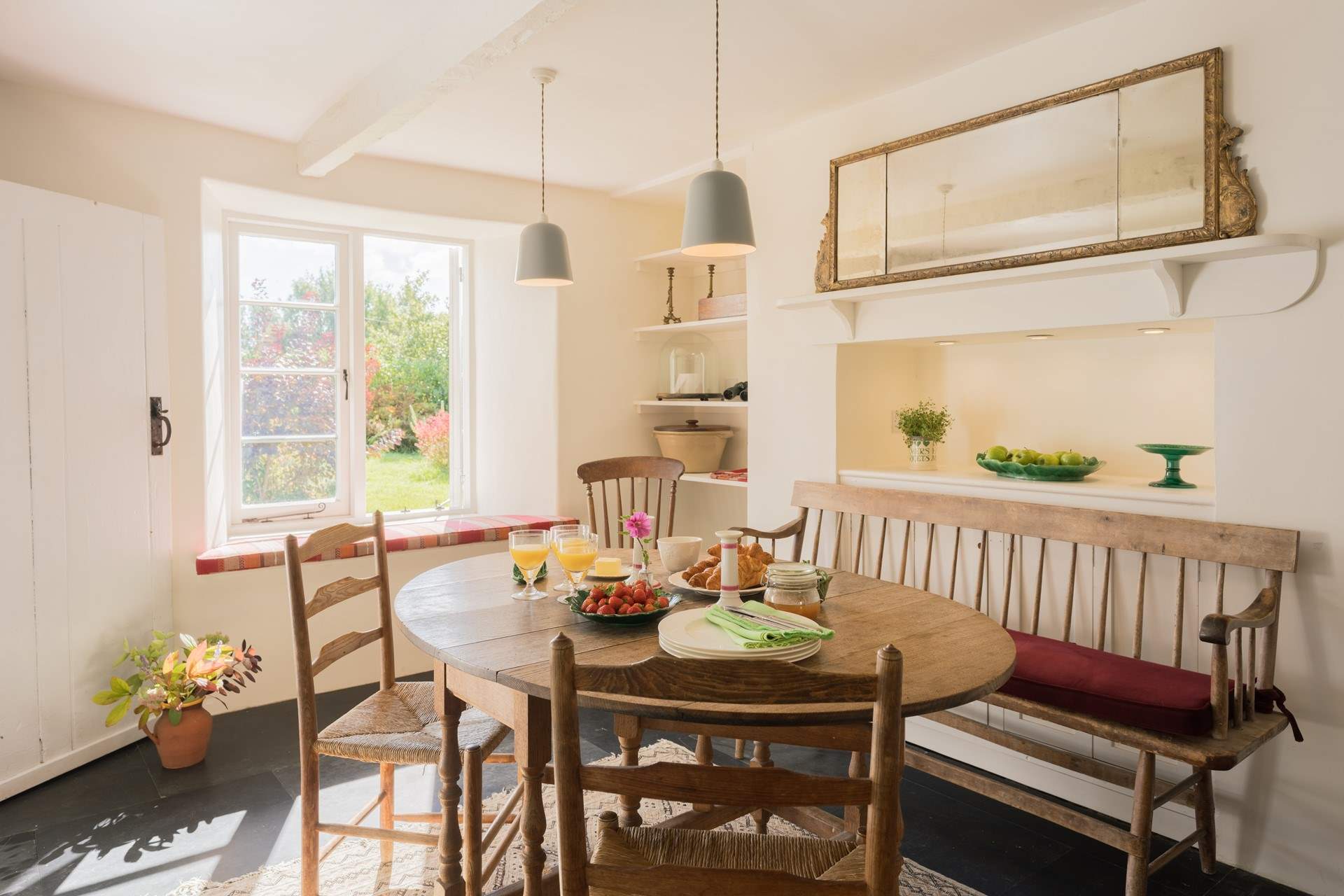 This attractive dining-room is bright and inviting.  