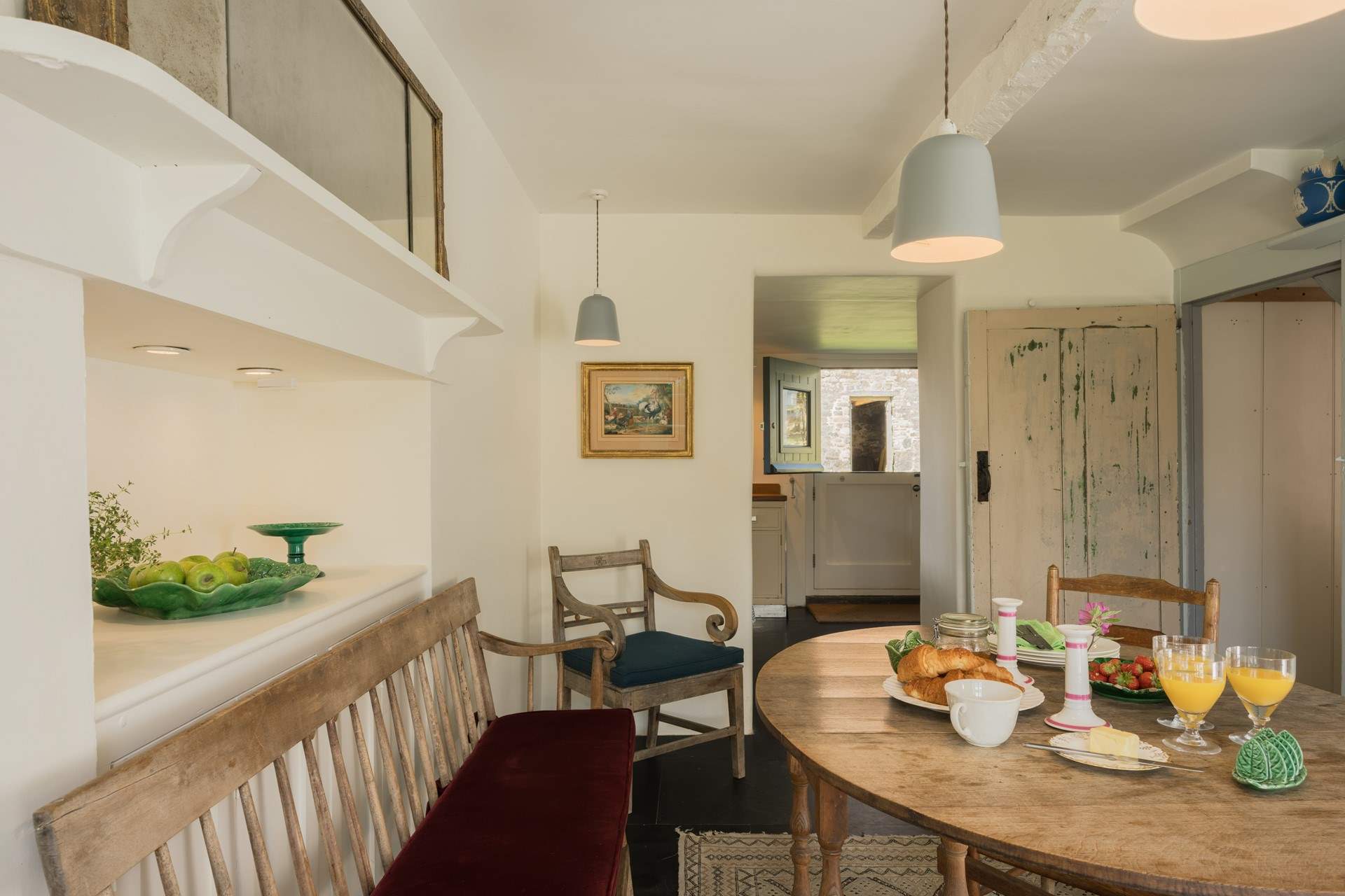 Head out to the back of the house where you will find the kitchen and utility-room with access to the back of the house. 