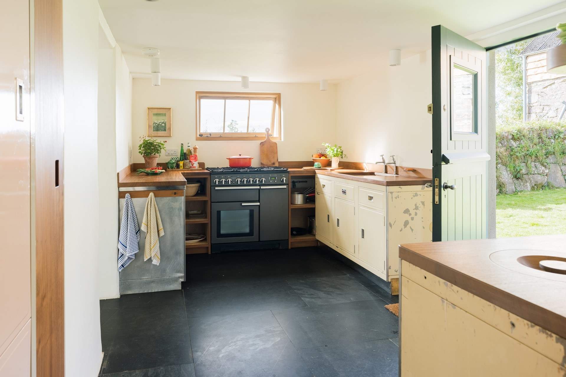 The kitchen is the heart of any farmhouse, and with the aged Paul Metalcraft free-standing units it's a kitchen the cook will enjoy.