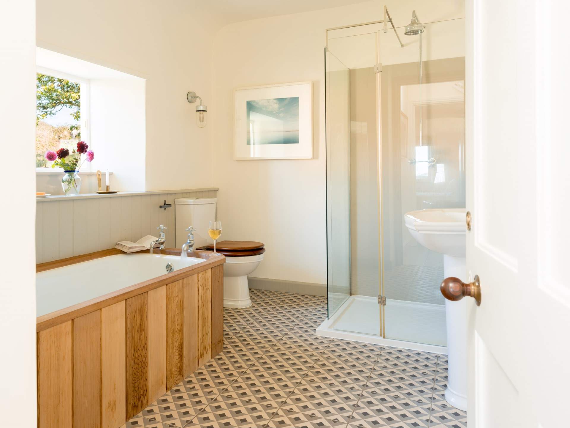 A relaxing bubble bath with a good book awaits in the cast-iron bath.
