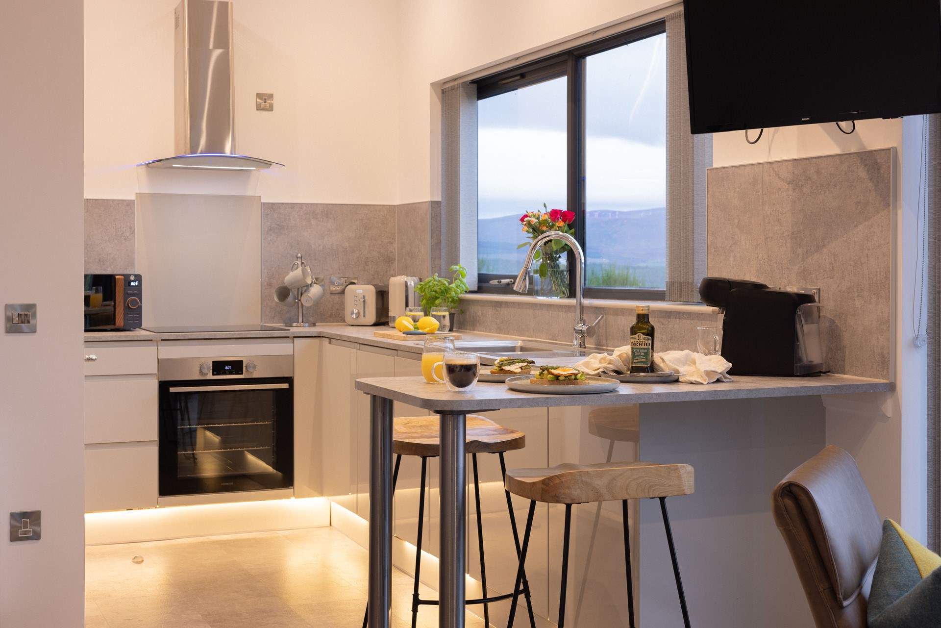 The luxe kitchen is equipped with everything you need for your getaway.