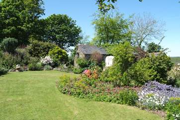 Bunnell Cottage, with its wonderful cottage garden at the front, adjoins the Owner's home (on the right).