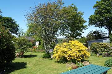 The picnic bench outside the conservatory is ideal for enjoying outdoor meals.
