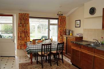 The very well-equipped kitchen leads through to the sunny conservatory.