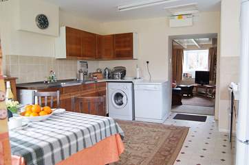 The well-equipped kitchen adjoins the sitting-room.