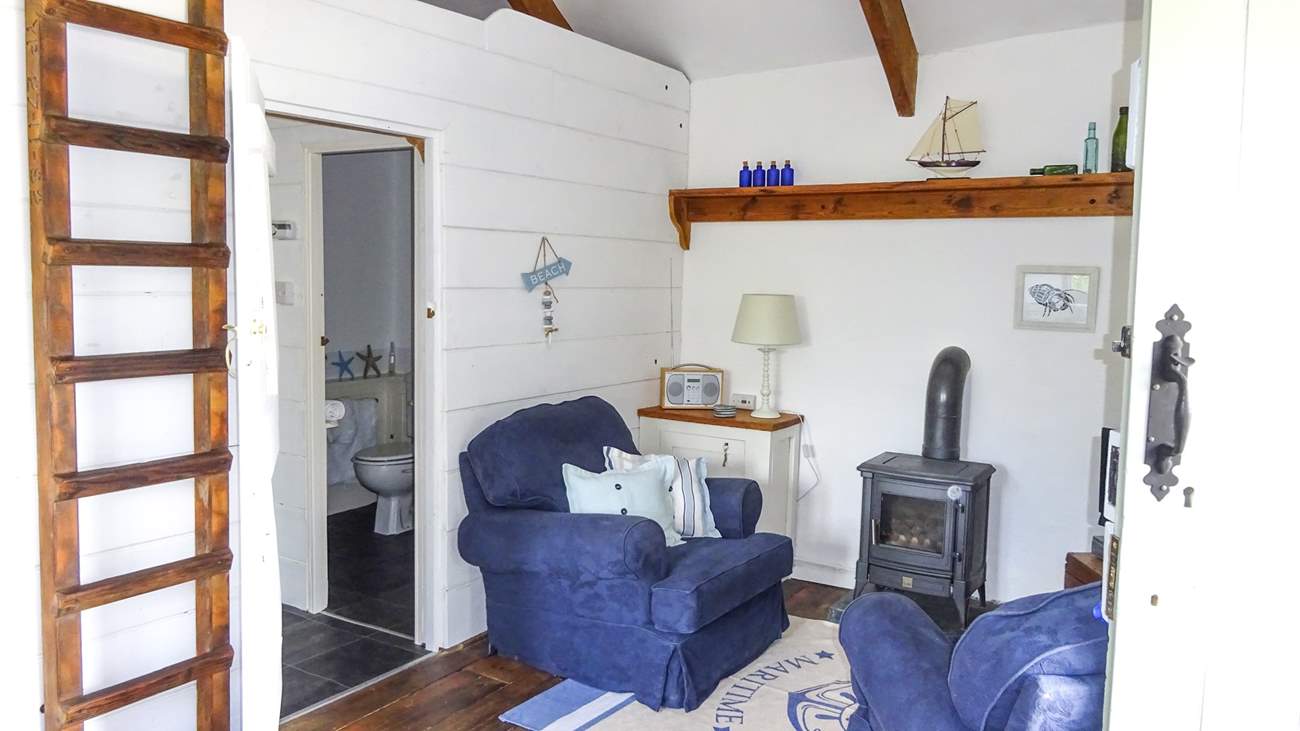 A gas-fired wood-burner style stove keeps this lovely cottage warm and cosy.