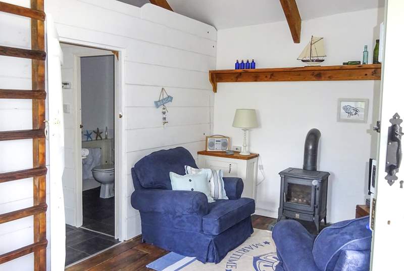 A gas-fired wood-burner style stove keeps this lovely cottage warm and cosy.