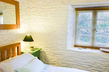 The very pretty bedroom is a lovely place to recharge after a day out exploring.