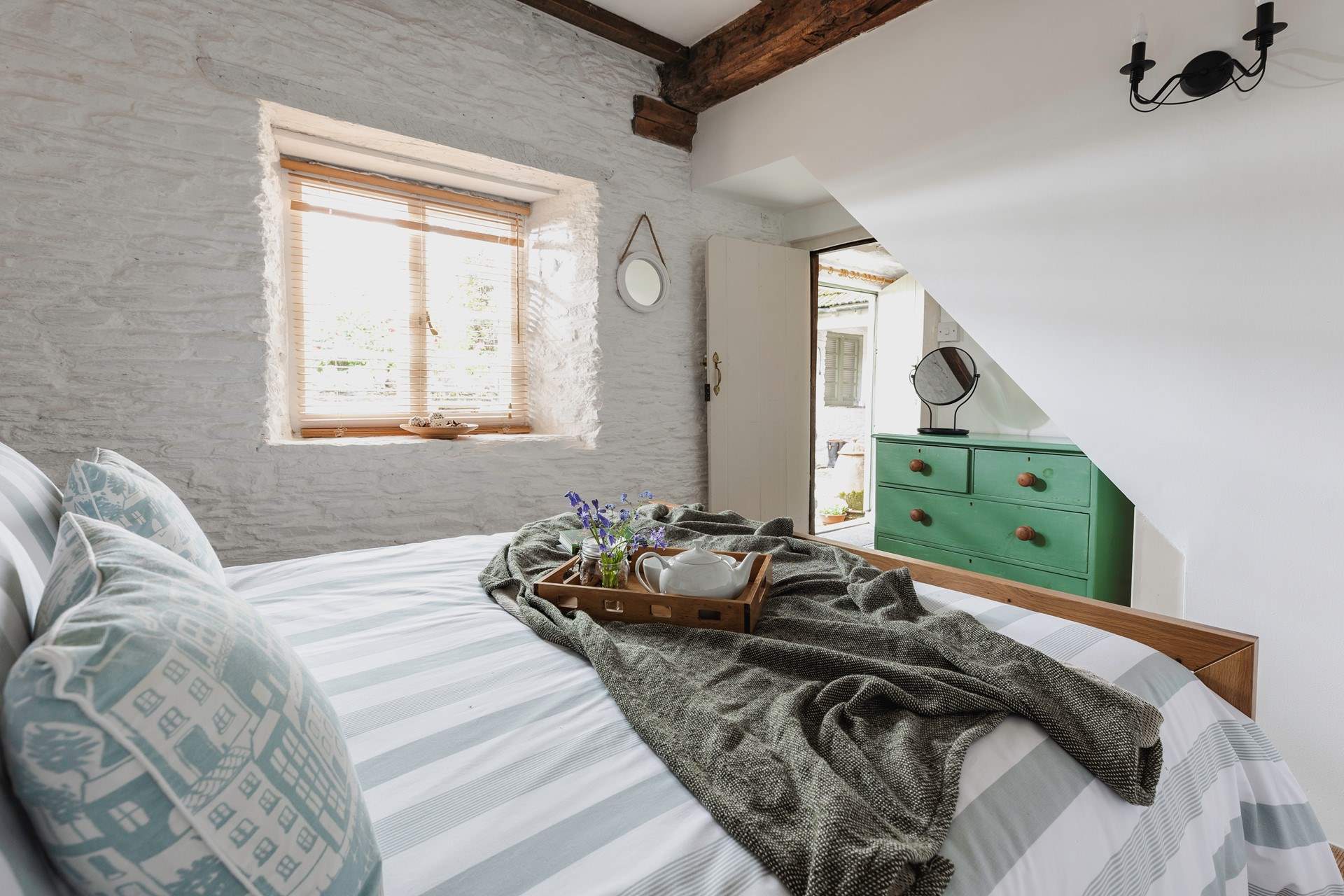 The very pretty bedroom is a lovely place to recharge after a day out exploring. 