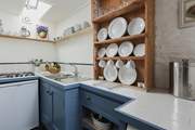 The small but perfectly formed kitchen. Please note, the gas hot has been replaced with an induction hob.