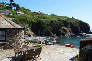 Beach Cottage is approached across the neighbouring property's patio.