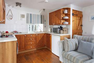 The compact kitchen is well-equipped.