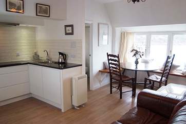 The light and surprisingly spacious open plan living-area with space to cook, eat and relax with the most amazing view.