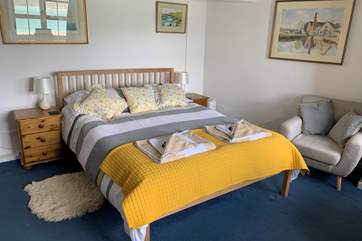 The ground floor double bedroom with an en suite shower cubicle and fabulous sea views.