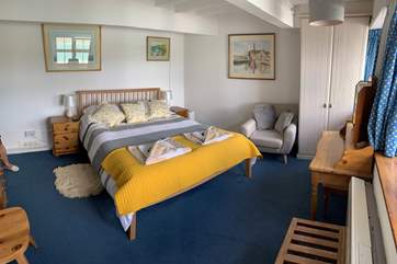 Stretch out in the king size bed.