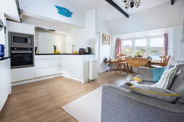 The light and surprisingly spacious open plan living-area with space to cook, eat and relax with the most amazing view.