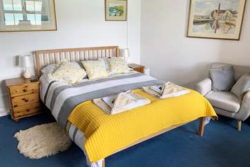 The ground floor double bedroom with an en suite shower cubicle and fabulous sea views.