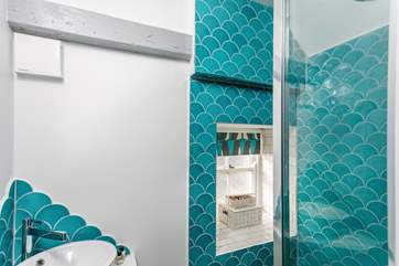 The seaside theme continues in the shower-room.