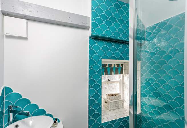 The seaside theme continues in the shower-room.