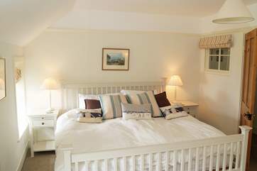 Spacious Bedroom 2 overlooks the cove and the sea beyond, (this bed has two 3ft single mattresses on the 6ft bed frame).