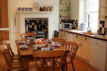 The kitchen, complete with farmhouse kitchen table, is extremely well-equipped.
