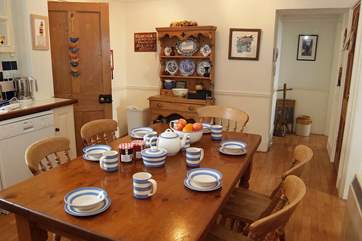 The kitchen is the heart of the cottage and leads to the sitting-room, dining-room and also the utility-room.