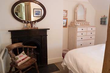 The original fireplace (decoration only) is a lovely feature in this room (Bedroom 3).