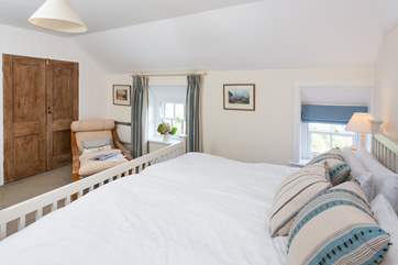 Lie back and look at the view from this super-king bed (Bedroom 2).