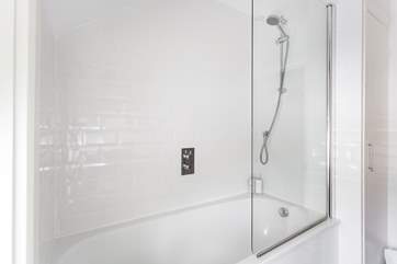 There is a shower over the bath.