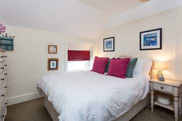 This cosy bedroom is tucked away at the back of the house, away from any stormy winds (Bedroom 3).
