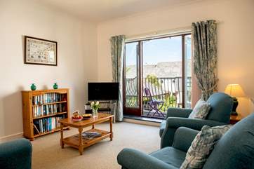 The lovely light sitting-room with a sunny balcony.