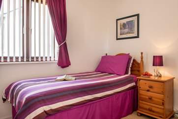 The single bedroom (bedroom two) overlooks the communal garden.