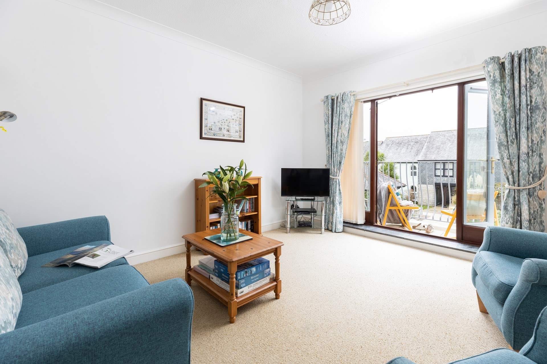 The lovely light sitting-room with a sunny balcony.