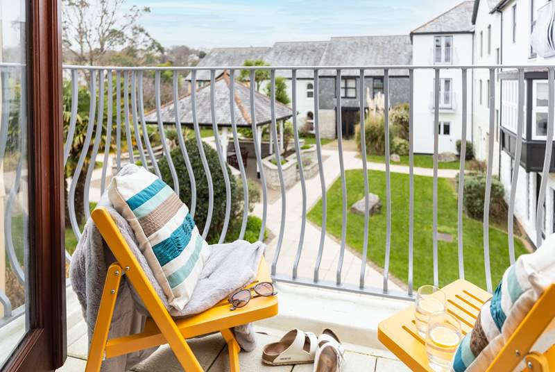 Sit on the balcony and enjoy the outside space after a day on the beach.
