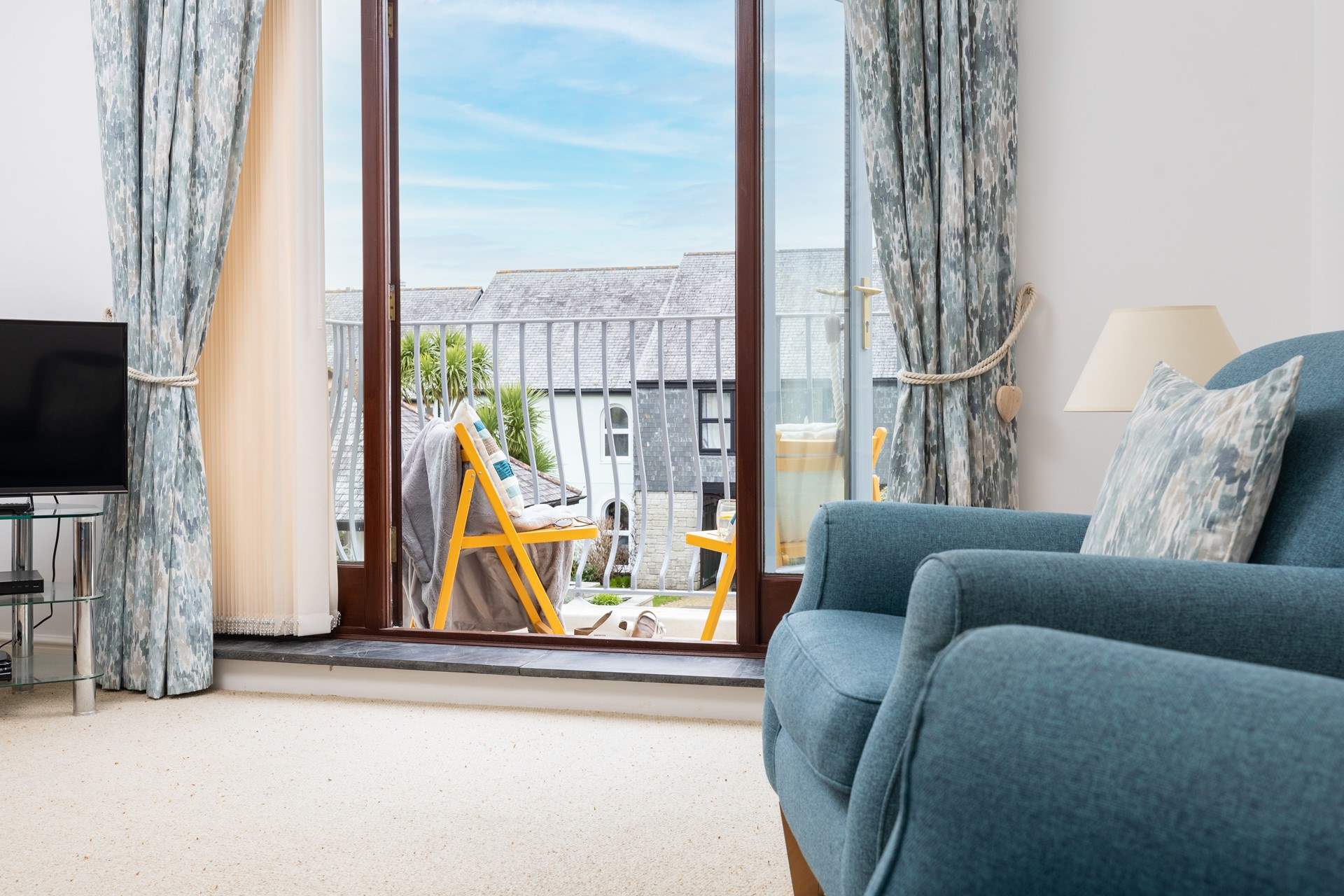 The French windows open to your balcony; let the sea air in.