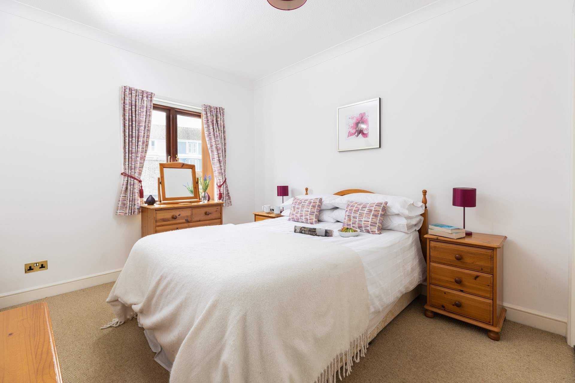 The pretty double bedroom is light and bright.