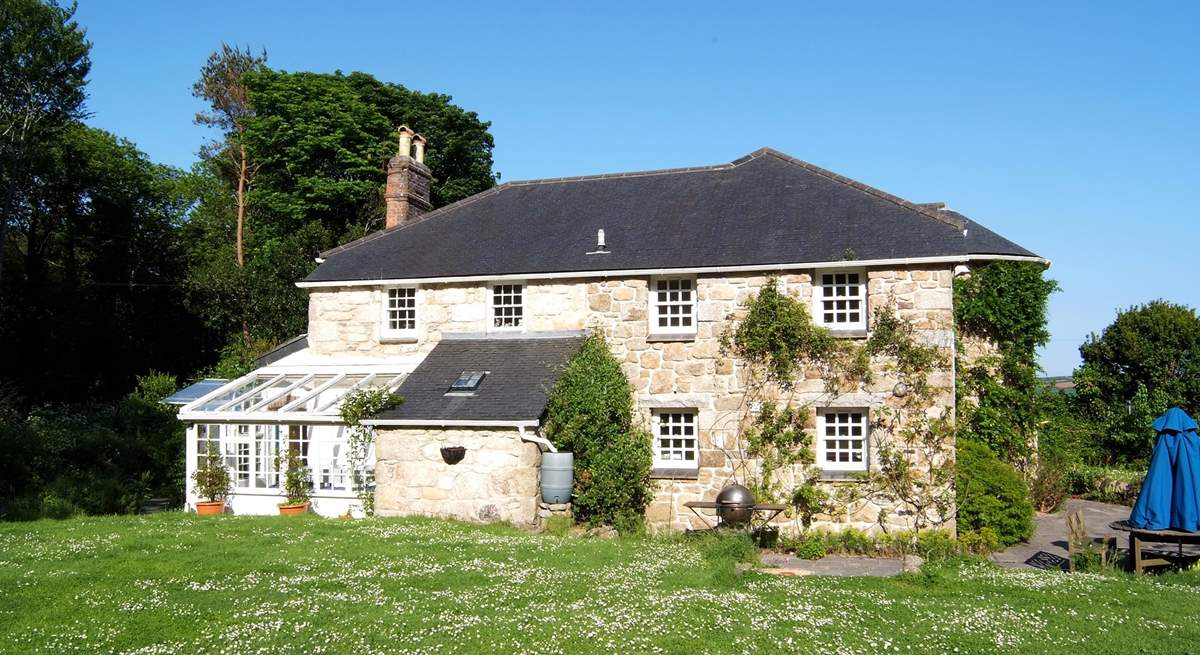 Golden Cock Cottage is surrounded by fabulous gardens.