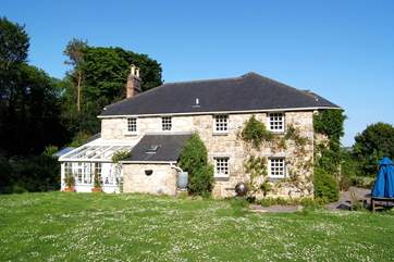 Golden Cock Cottage is surrounded by fabulous gardens.