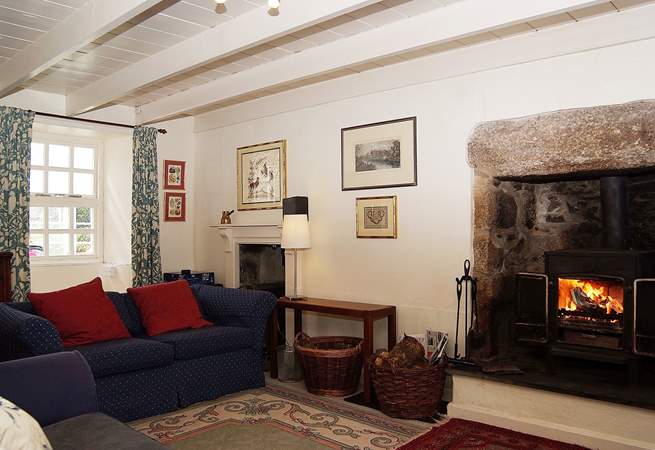 The sitting-room has a cosy wood-burner.